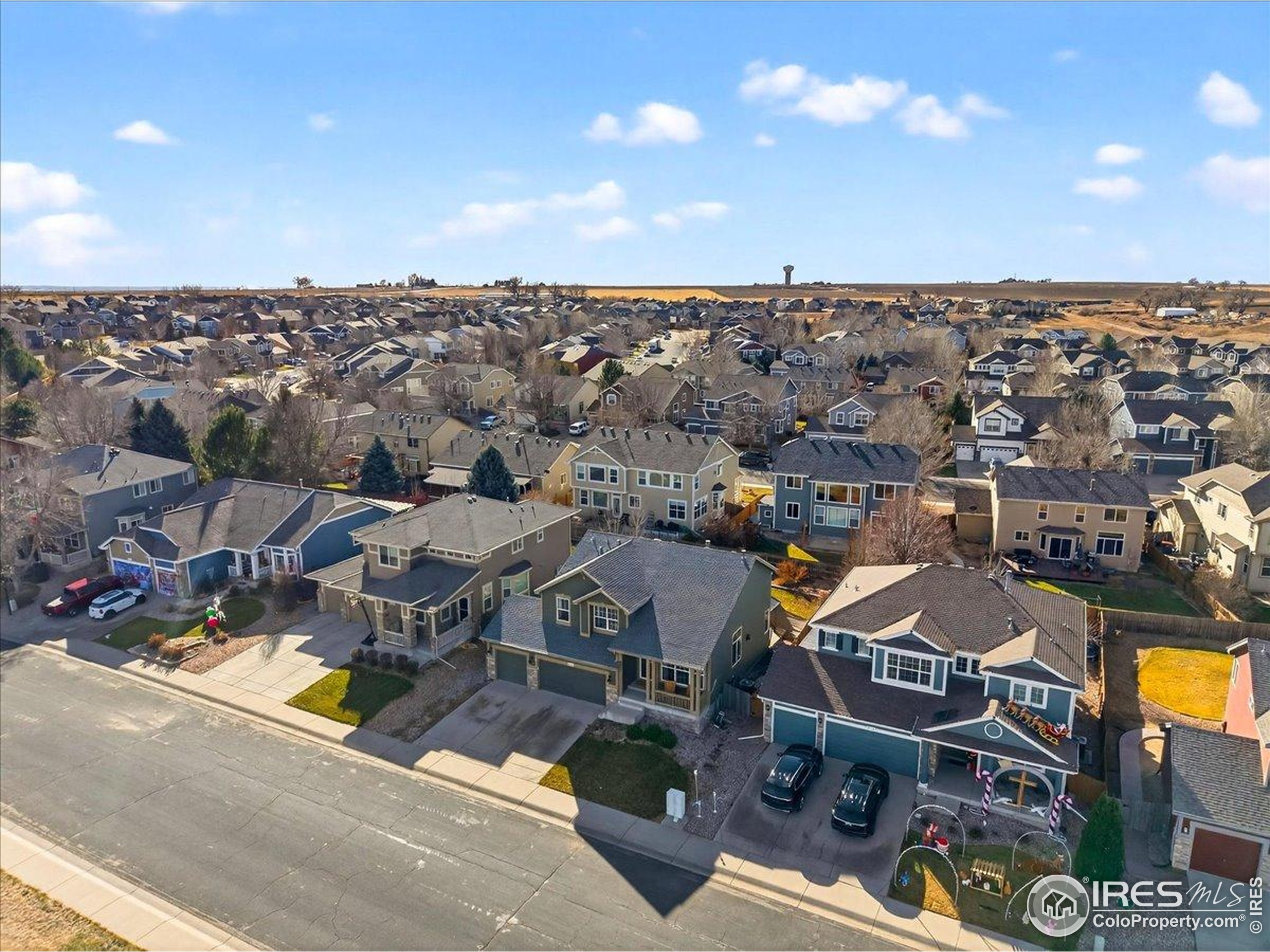 210 Saxony Road Johnstown, CO 80534 - Photo 33 of 34 an aerial view of a houses with a swimming pool
