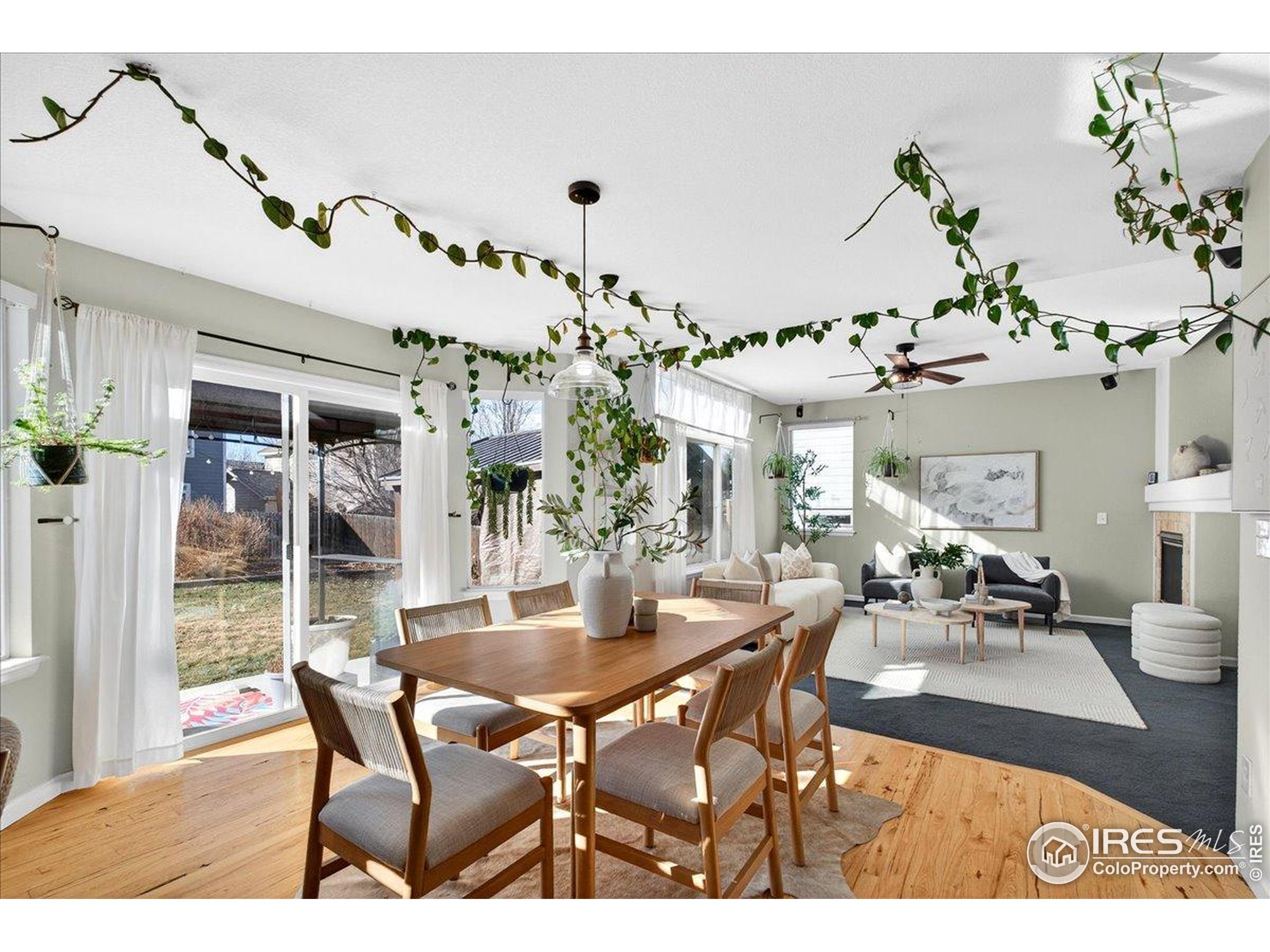 210 Saxony Road Johnstown, CO 80534 - Photo 7 of 34 a view of a dining room with furniture and chandelier
