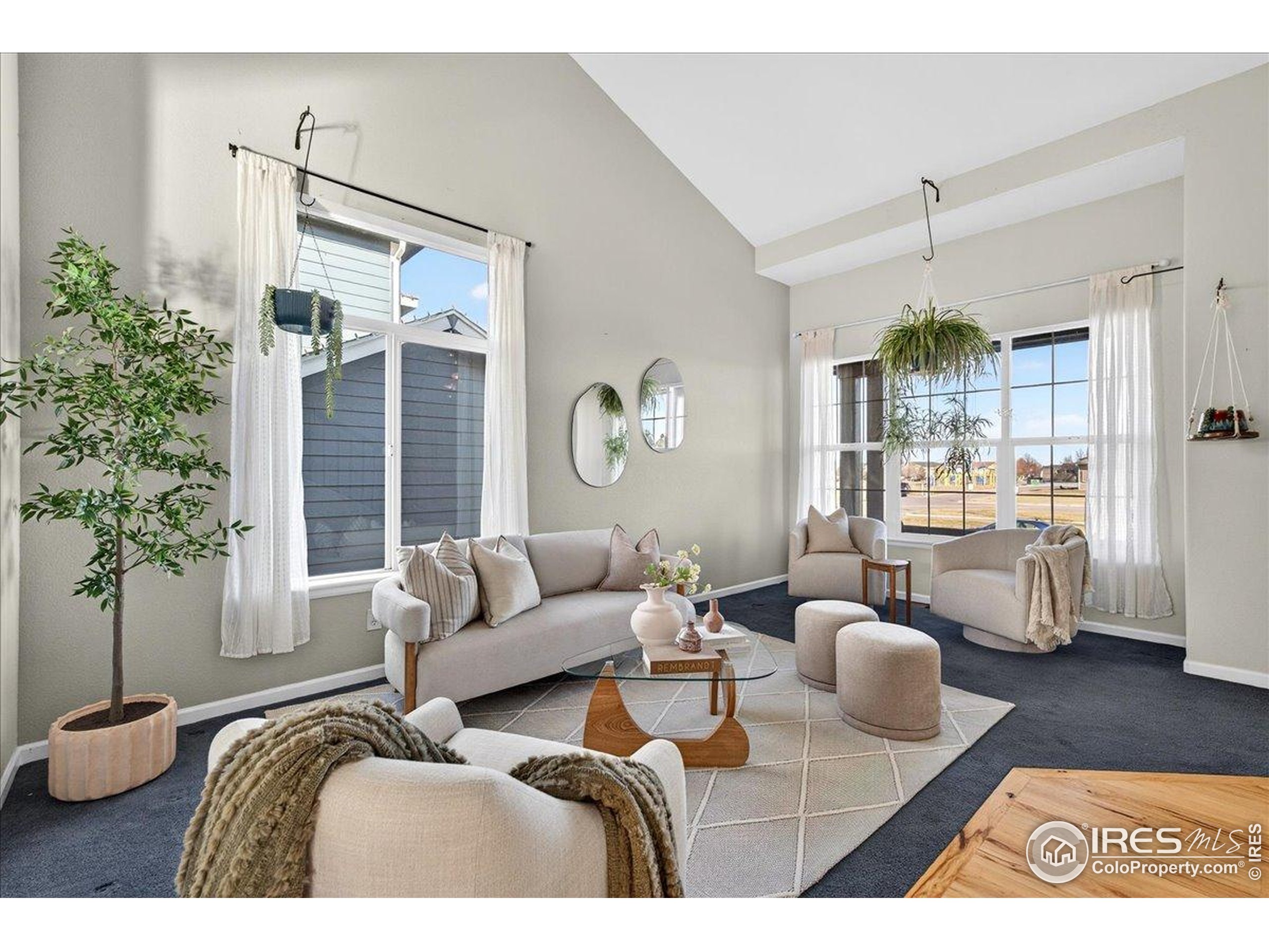 210 Saxony Road Johnstown, CO 80534 - Photo 8 of 28 a living room with furniture and a large window