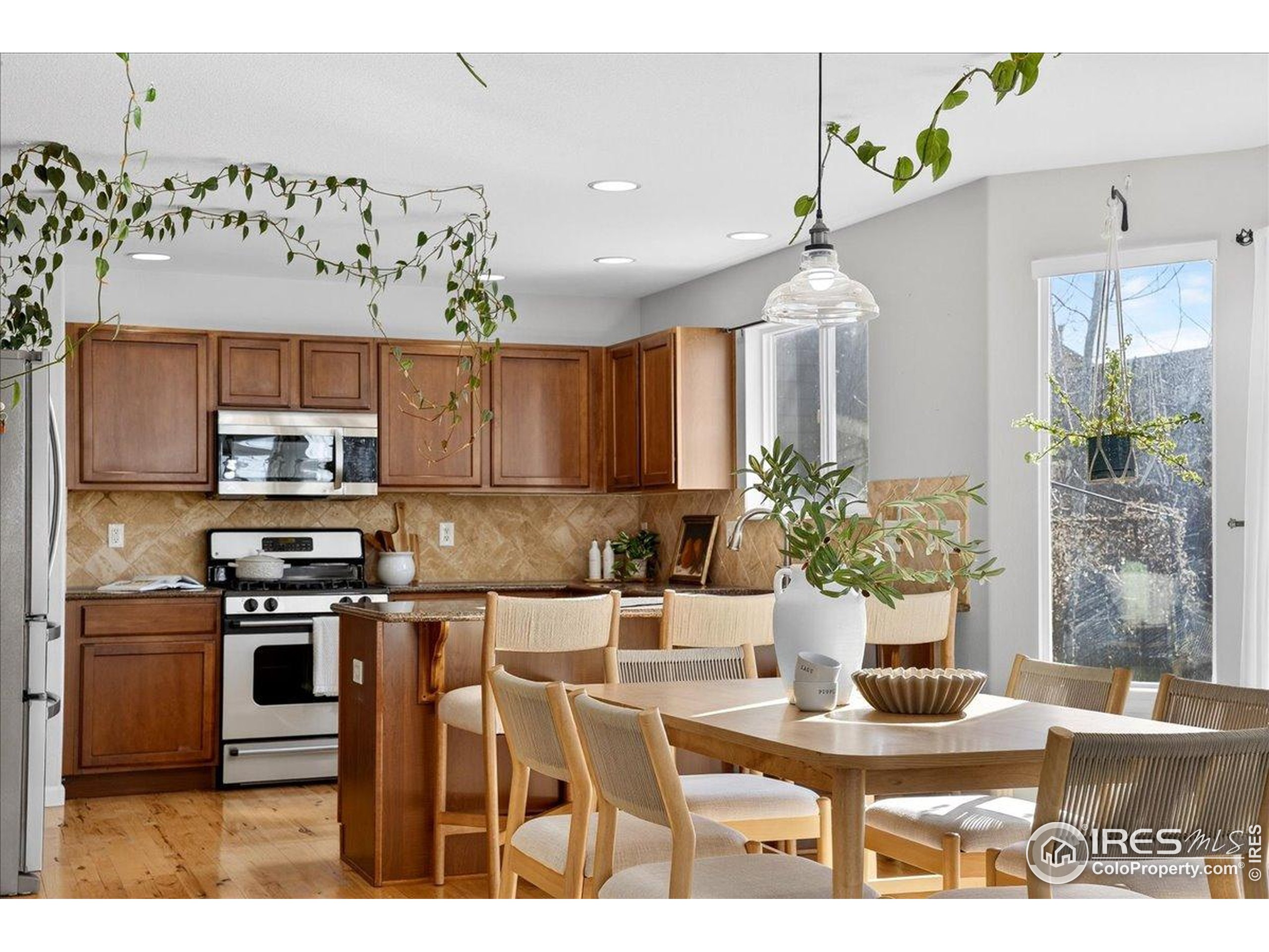 210 Saxony Road Johnstown, CO 80534 - Photo 9 of 28 a kitchen with a table and chairs in it