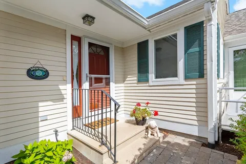 a view of a balcony with a potted plant
