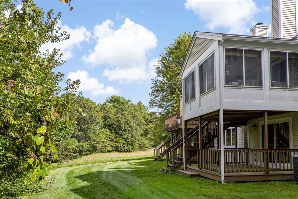 8 Chippers Lane, Unit 390 Mashpee, MA 02649 - Photo 26 of 38 a view of small house with yard in front of it