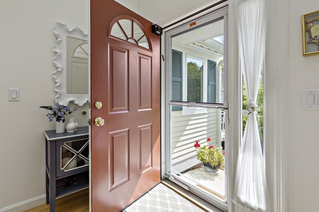 8 Chippers Lane, Unit 390 Mashpee, MA 02649 - Photo 3 of 38 a front view of a house with entryway