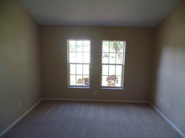 1234 Southwest Chase Road Port St. Lucie, FL 34953 - Photo 13 of 20 an empty room with a window