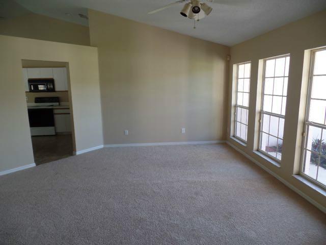 1234 Southwest Chase Road Port St. Lucie, FL 34953 - Photo 3 of 20 a view of an empty room with a window