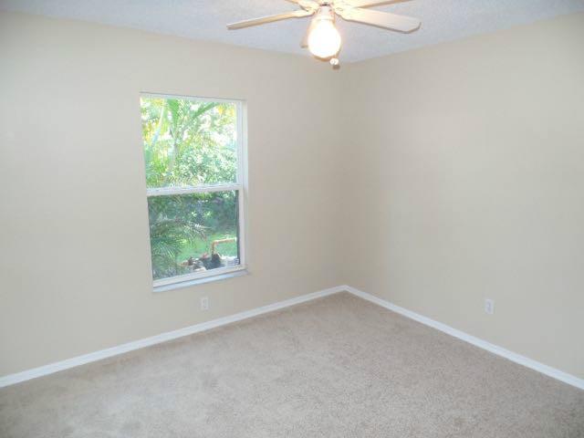 1234 Southwest Chase Road Port St. Lucie, FL 34953 - Photo 8 of 20 an empty room with a window