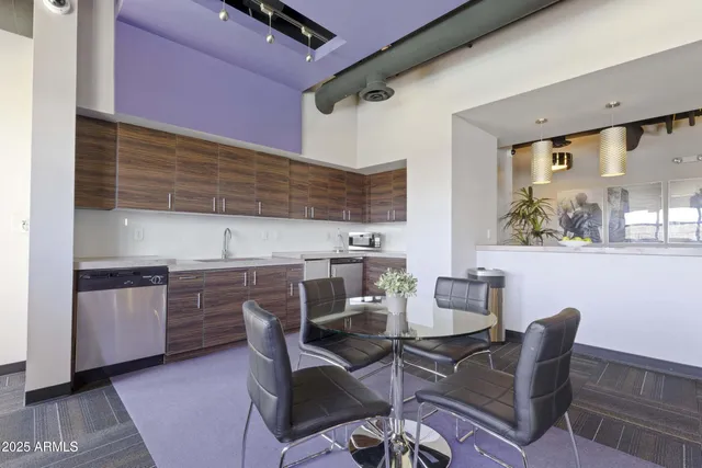 a dining room with furniture and wooden floor
