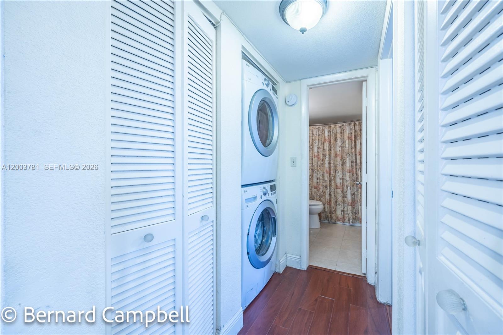 3940 Inverrary Boulevard, Unit 403A Lauderhill, FL 33319 - Photo 16 of 37 a view of a hallway with washer and dryer