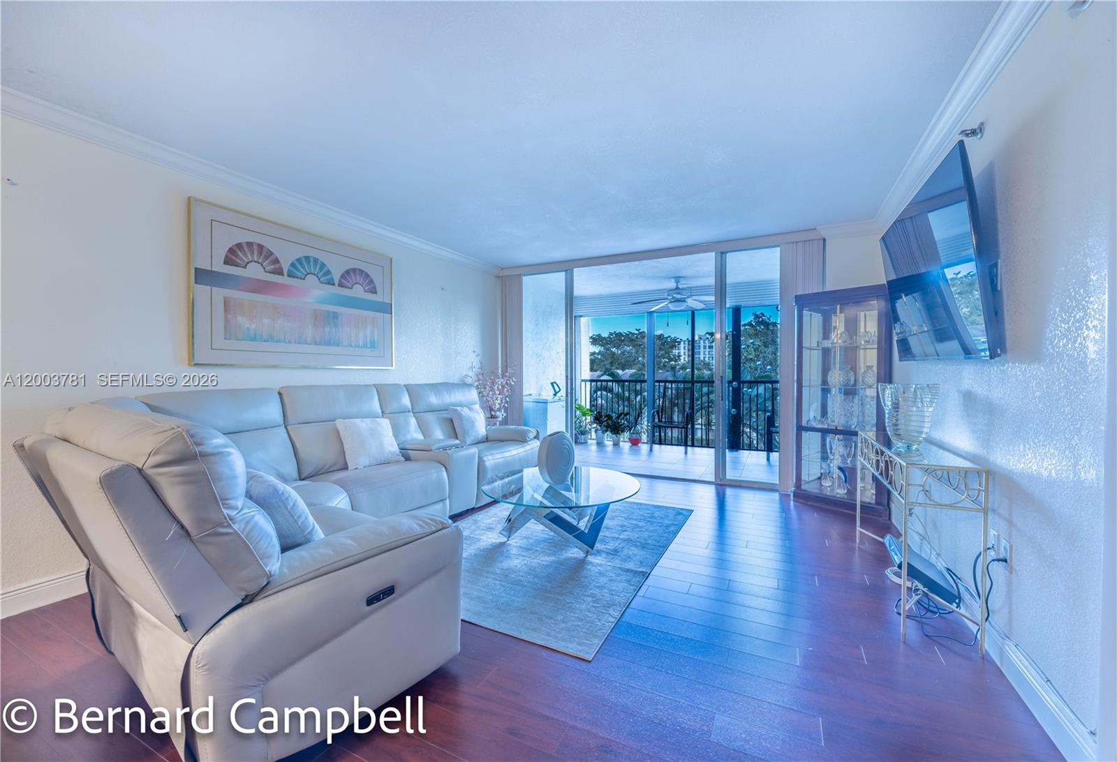 3940 Inverrary Boulevard, Unit 403A Lauderhill, FL 33319 - Photo 24 of 37 a living room with furniture and a large window