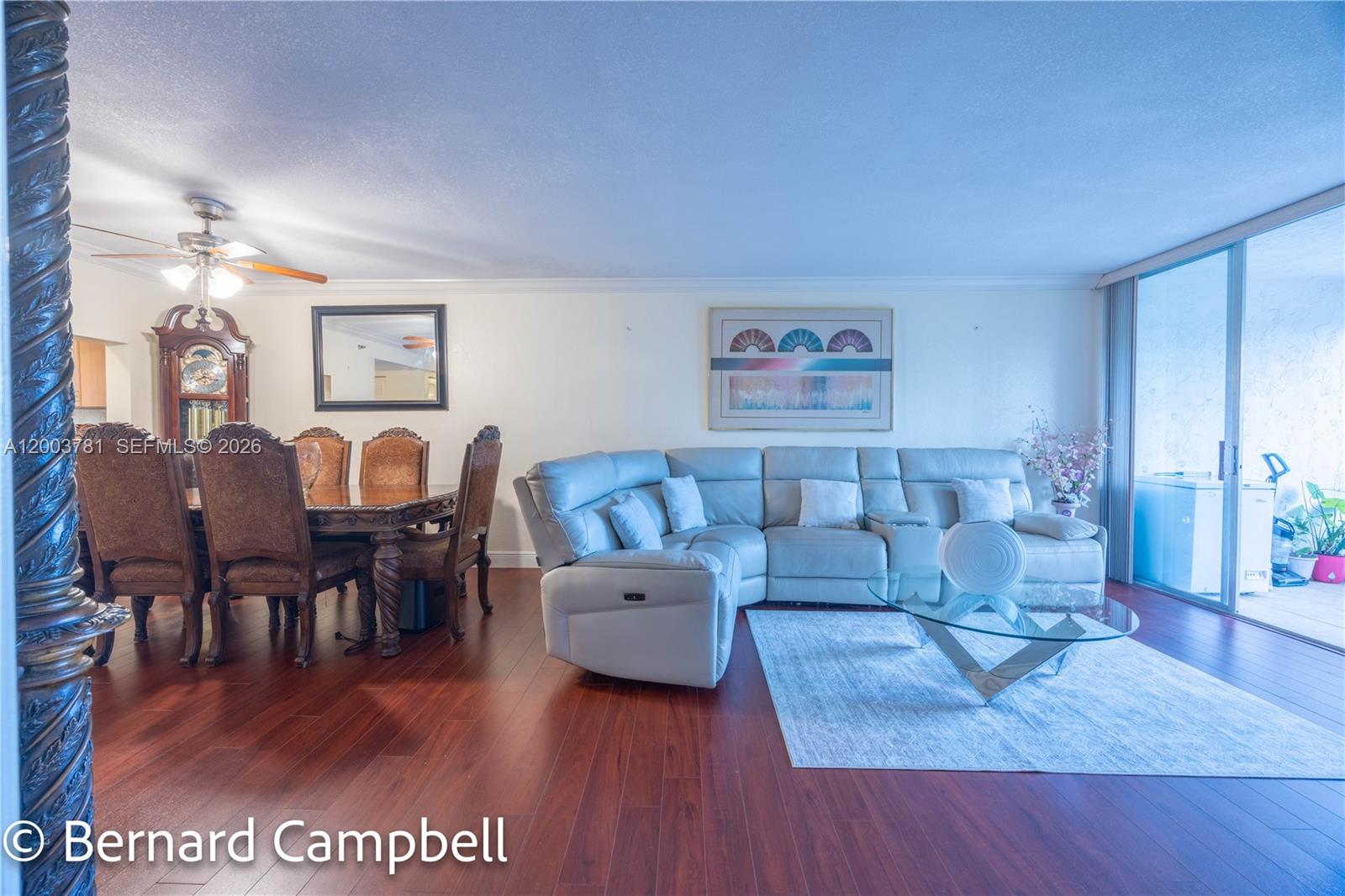 3940 Inverrary Boulevard, Unit 403A Lauderhill, FL 33319 - Photo 25 of 37 a living room with furniture and a wooden floor