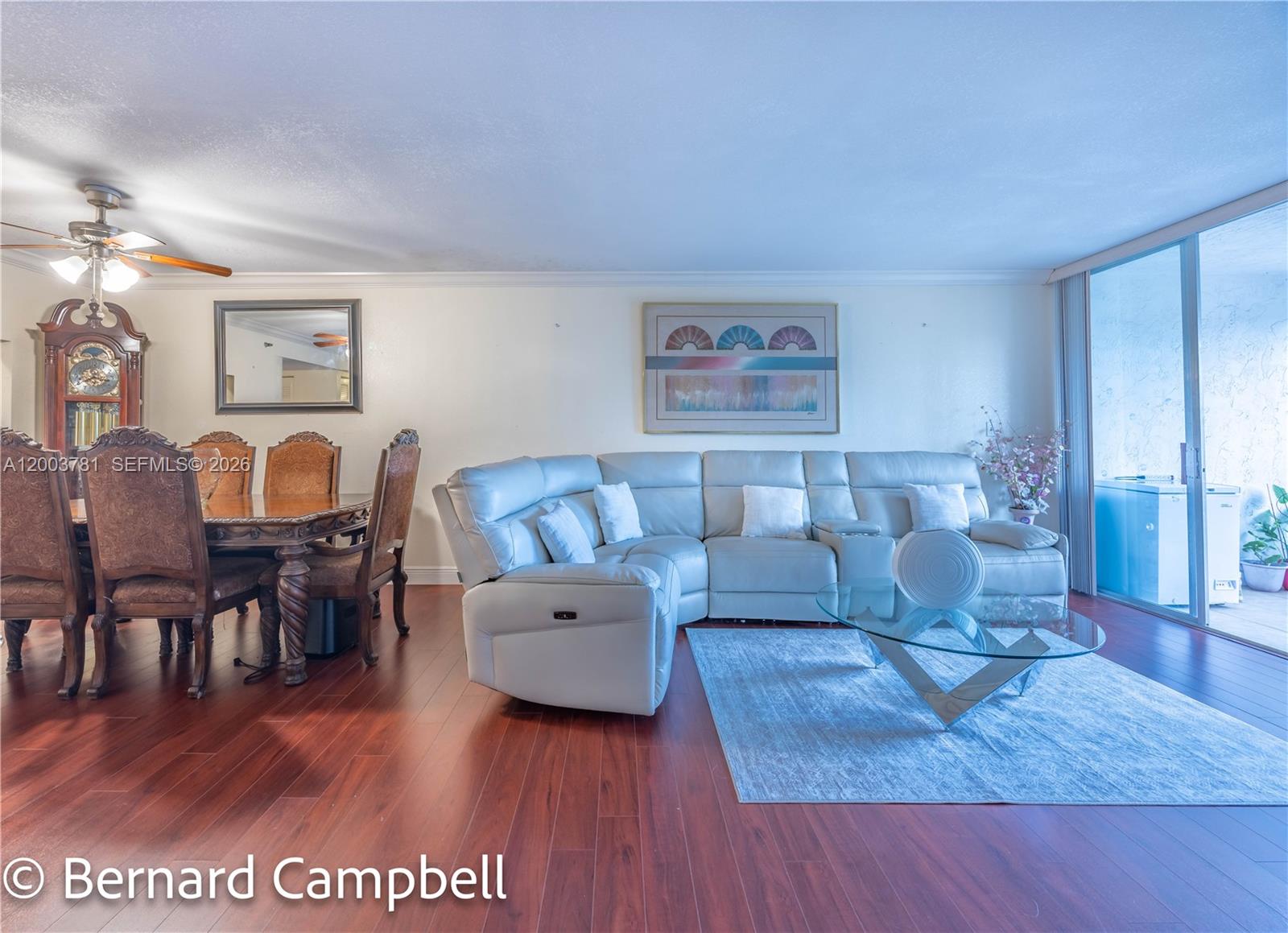 3940 Inverrary Boulevard, Unit 403A Lauderhill, FL 33319 - Photo 26 of 37 a living room with furniture and wooden floor