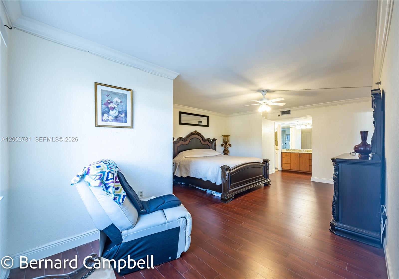 3940 Inverrary Boulevard, Unit 403A Lauderhill, FL 33319 - Photo 7 of 37 a spacious bedroom with a bed and a couch