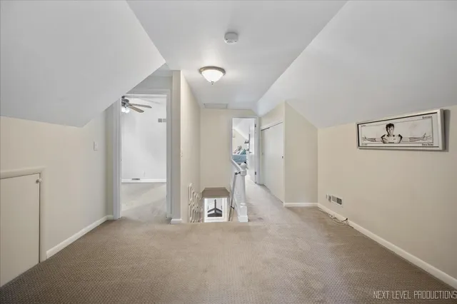 a view of a big room with closet and windows