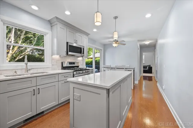 a kitchen with a sink and a refrigerator