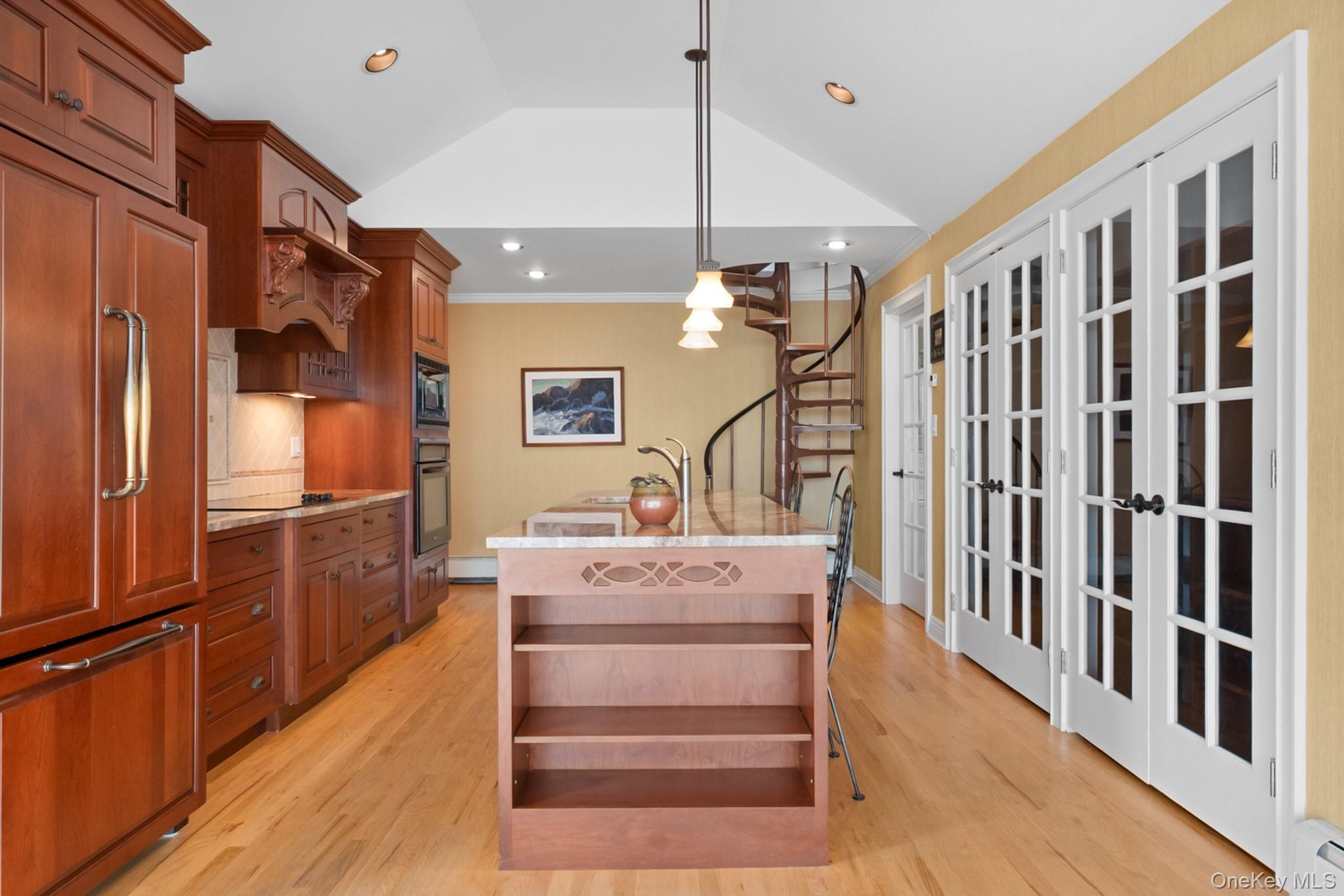 281 Woodacres Road East Patchogue, NY 11772 - Photo 5 of 11 Renovated kitchen with stainless steel appliances, island, high ceilings, and opens to sunroom/atrium.
