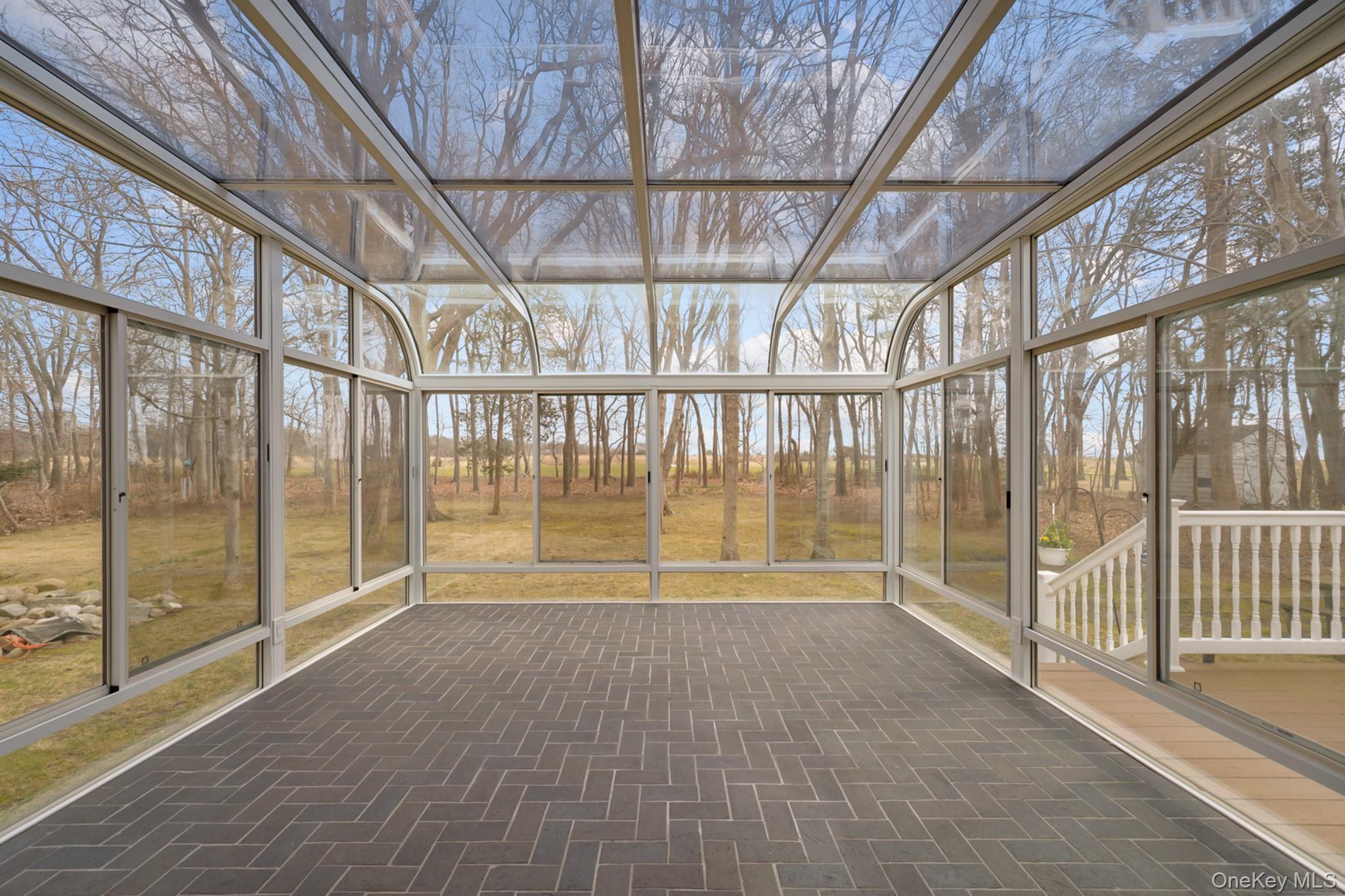 281 Woodacres Road East Patchogue, NY 11772 - Photo 6 of 11 Fully windowed atrium with stunning views. opens to deck.