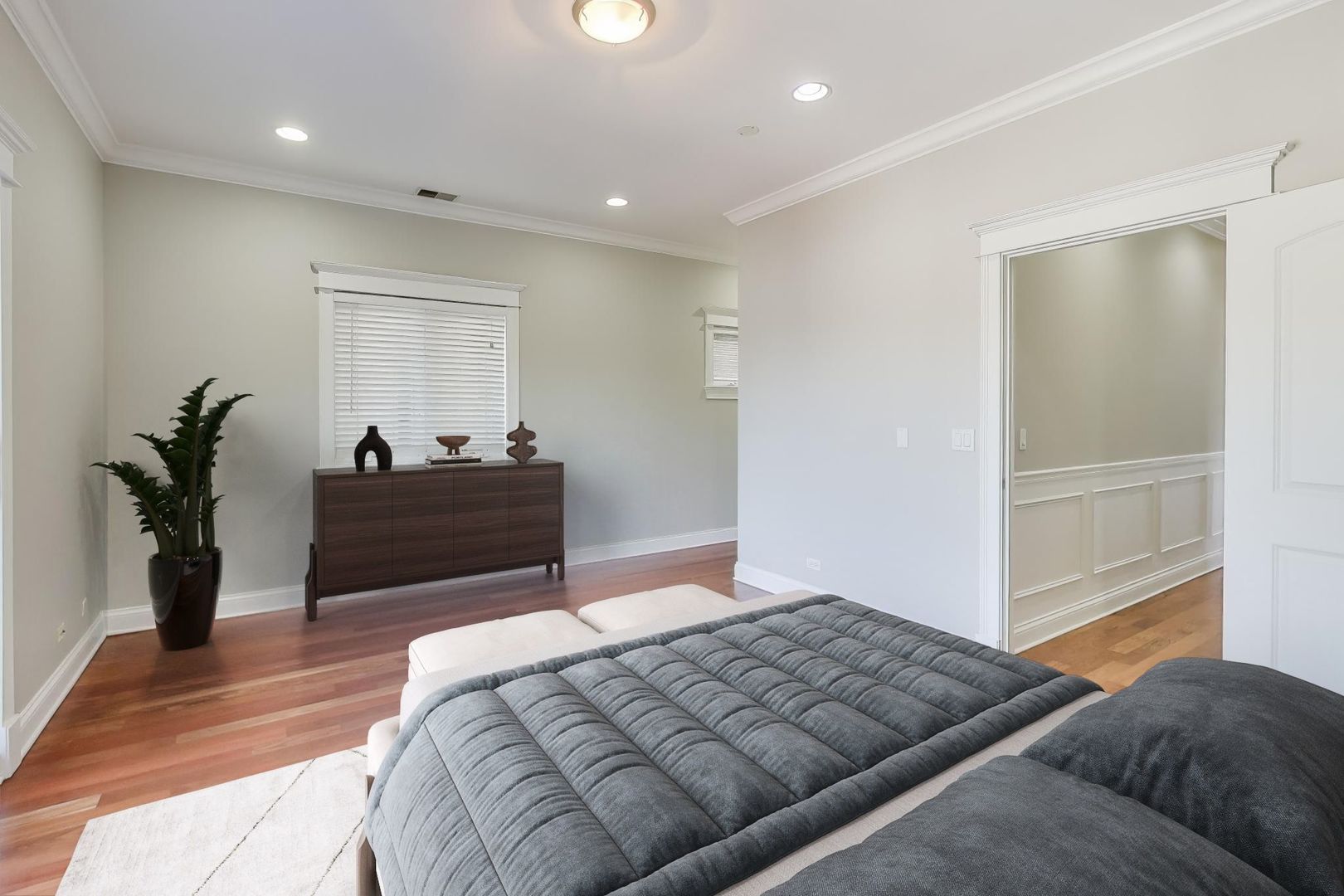 5058 North Kimball Avenue, Unit 4 Chicago, IL 60625 - Photo 13 of 26 a bedroom with a bed and a mirror