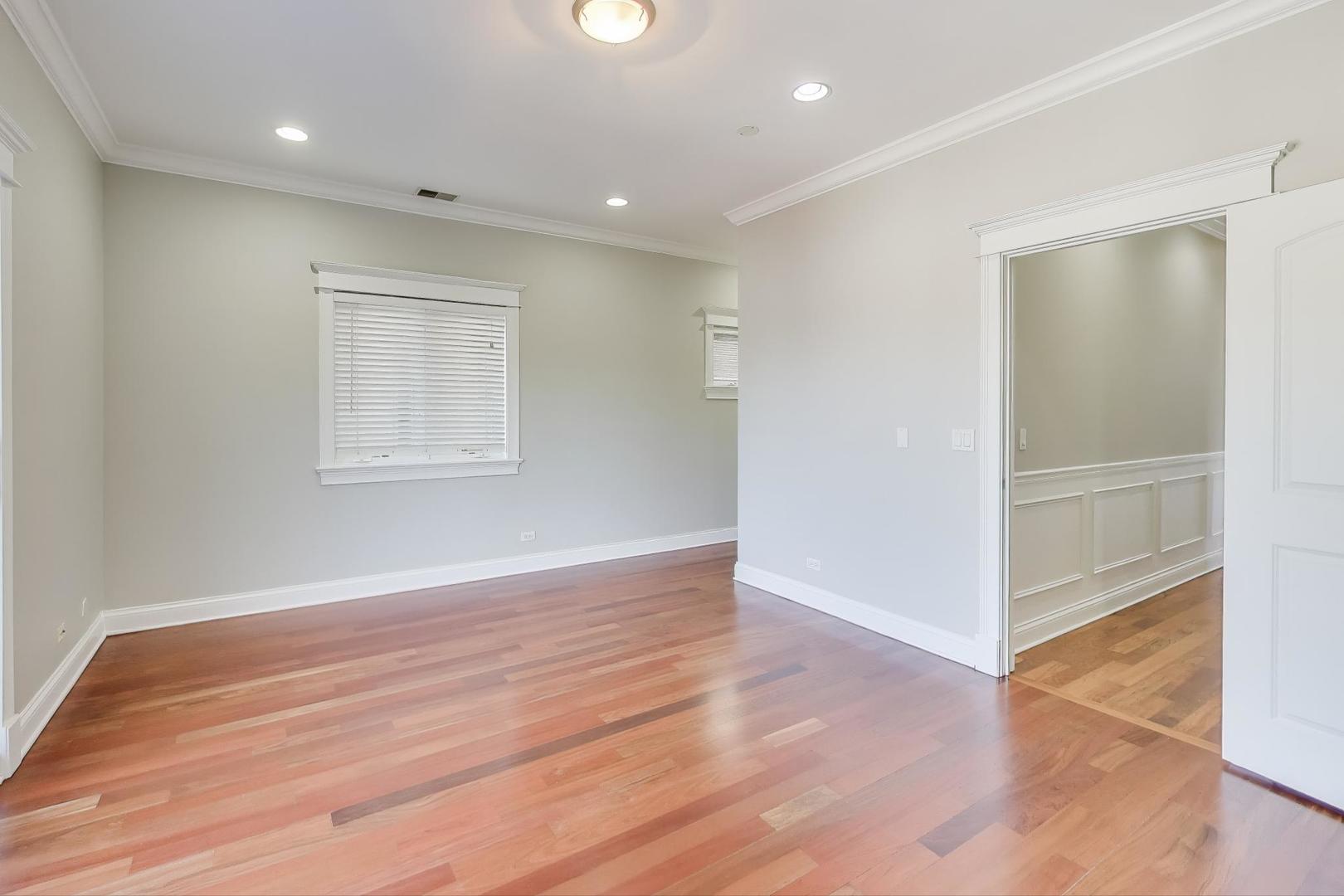 5058 North Kimball Avenue, Unit 4 Chicago, IL 60625 - Photo 14 of 26 wooden floor in an empty room with a window