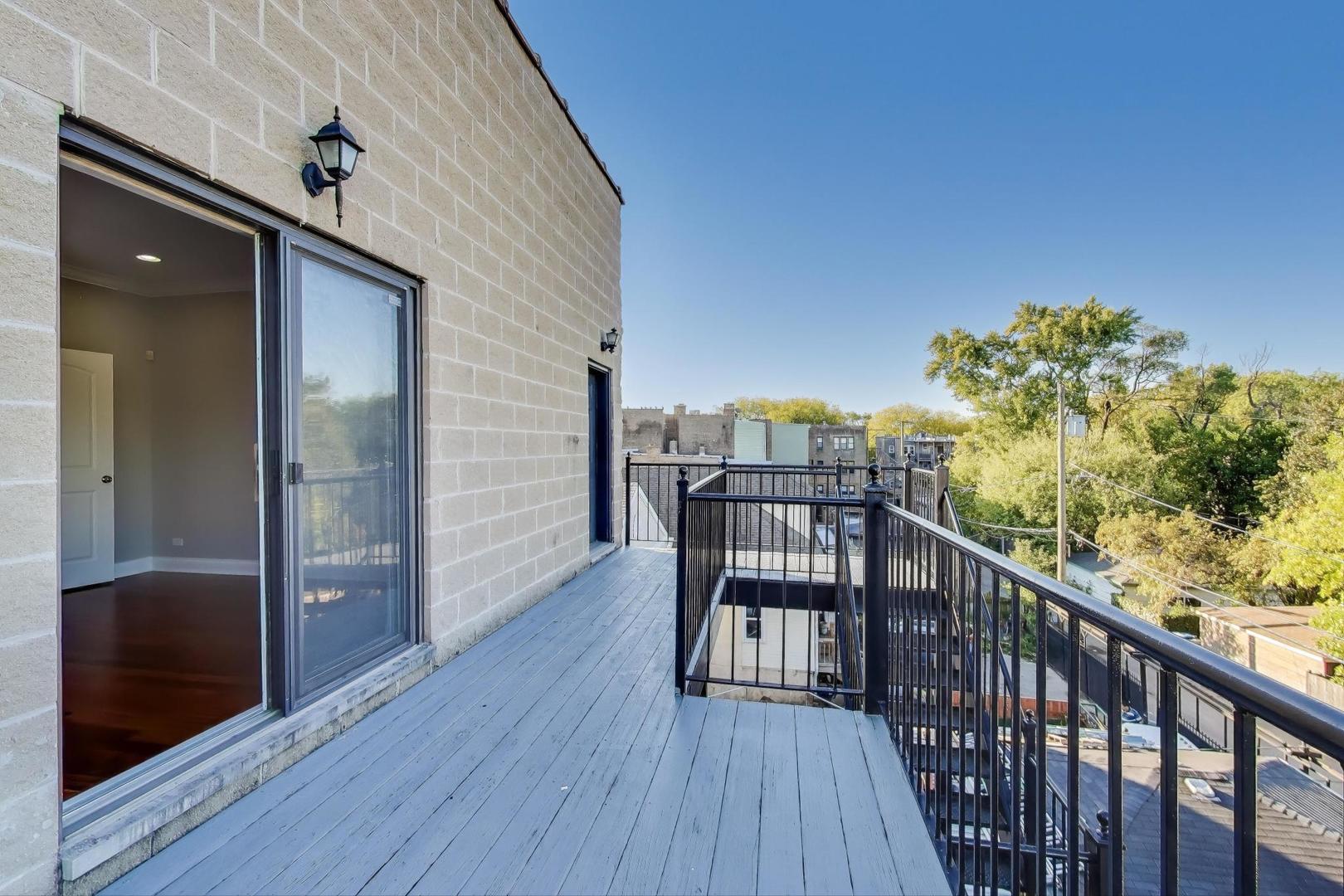 5058 North Kimball Avenue, Unit 4 Chicago, IL 60625 - Photo 23 of 26 a view of a balcony with chairs