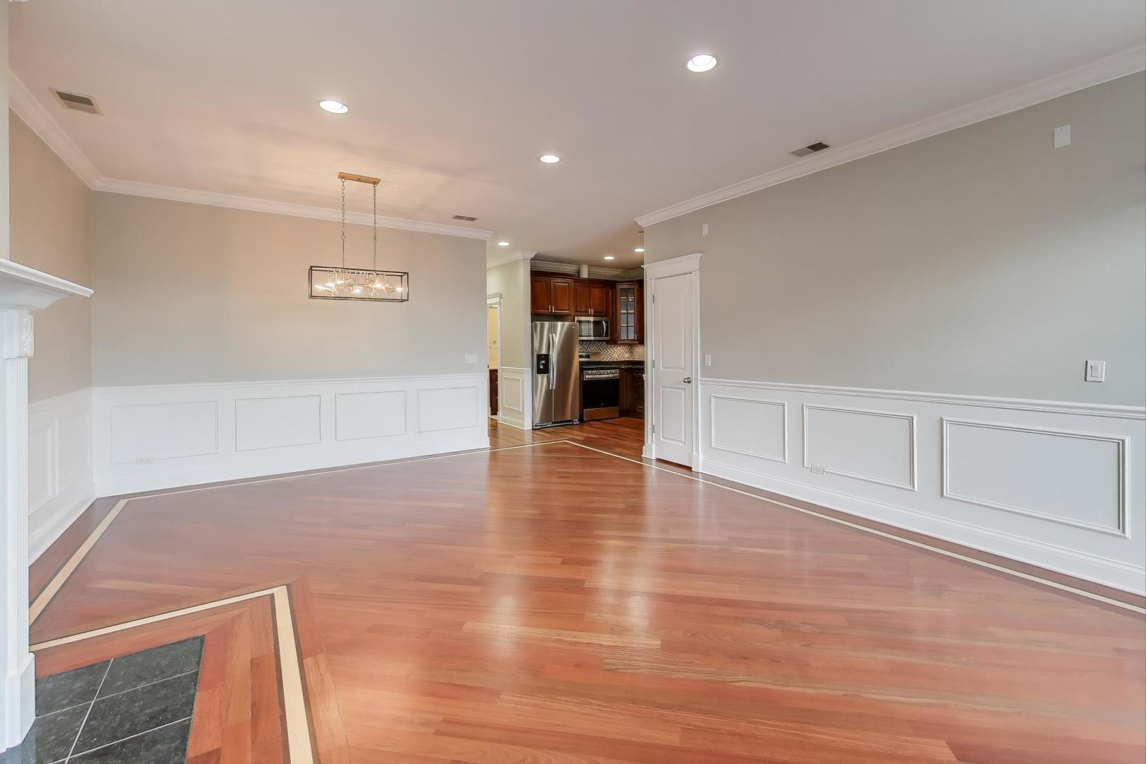 5058 North Kimball Avenue, Unit 4 Chicago, IL 60625 - Photo 6 of 26 a view of a livingroom with wooden floor