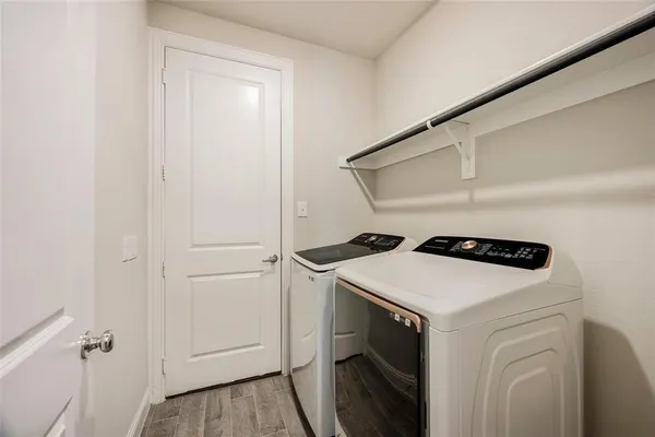 a utility room with dryer and washer