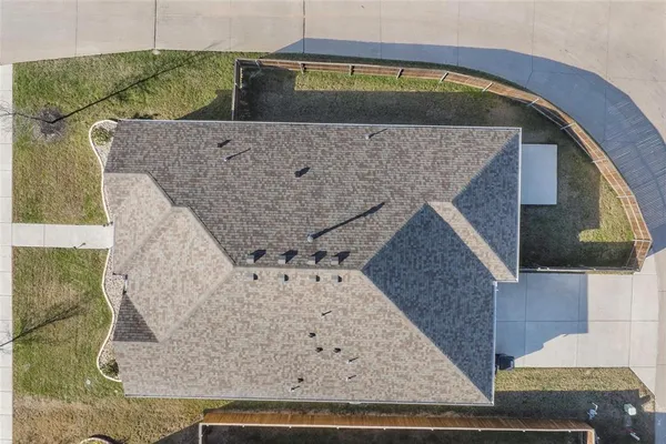 a view of a swimming pool with a yard
