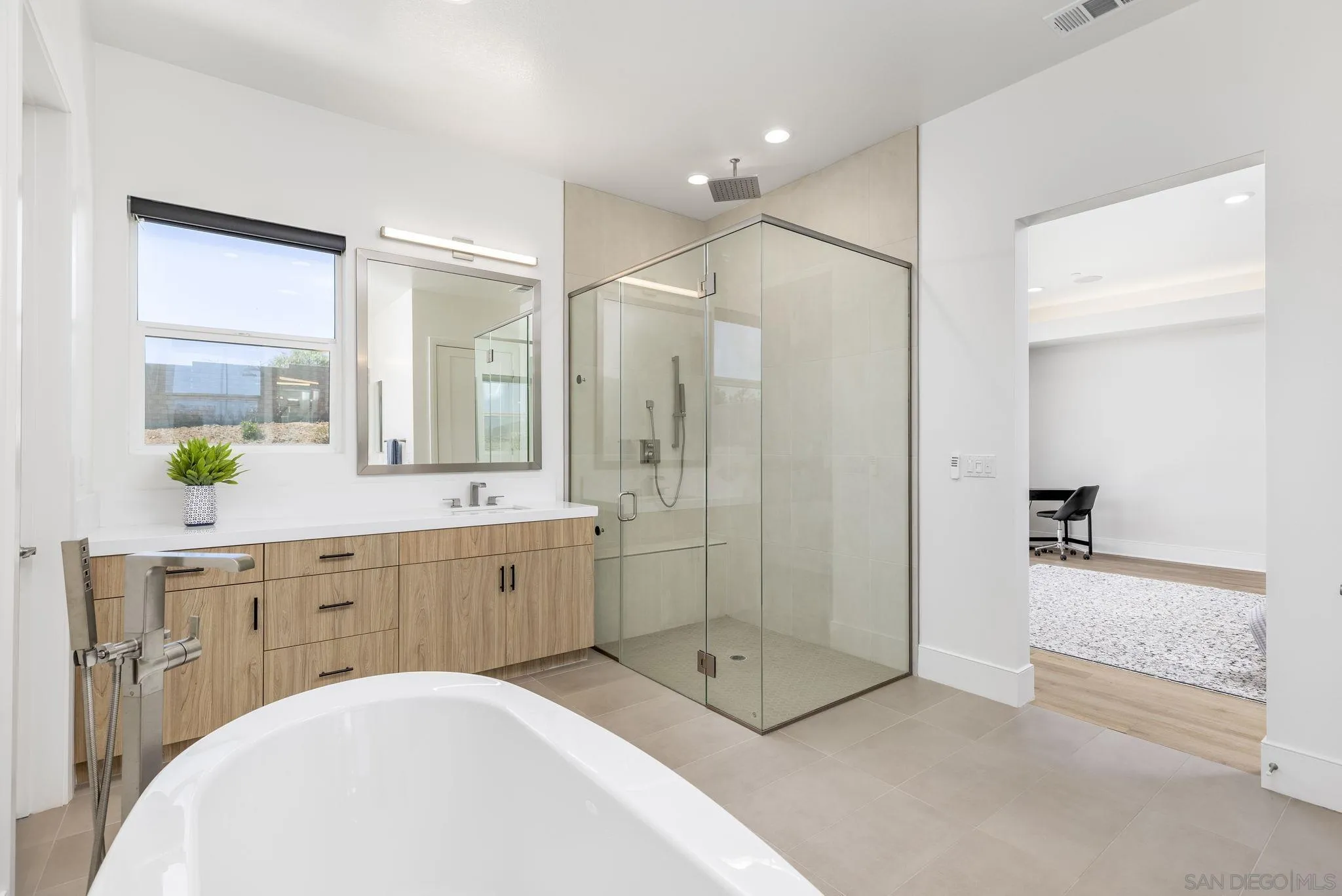 32213 Daybrook Terrace Temecula, CA 92591 - Photo 10 of 23 a spacious bathroom with a shower sink and mirror