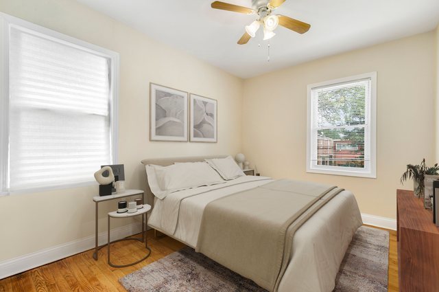 8458 South Constance Avenue Chicago, IL 60617 - Photo 11 of 23 a bedroom with a bed and wooden floor