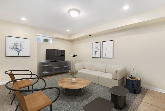 8458 South Constance Avenue Chicago, IL 60617 - Photo 13 of 23 a living room with furniture and a flat screen tv