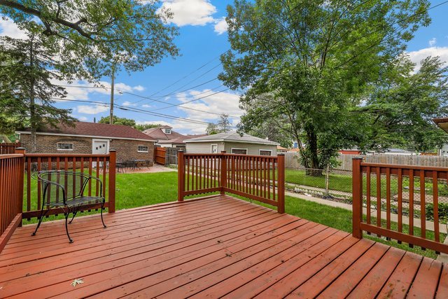 8458 South Constance Avenue Chicago, IL 60617 - Photo 19 of 23 a view of a deck with a garden