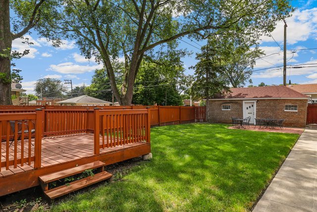 8458 South Constance Avenue Chicago, IL 60617 - Photo 20 of 23 a view of a backyard with a sitting area