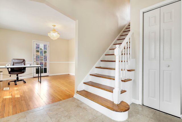8458 South Constance Avenue Chicago, IL 60617 - Photo 3 of 23 a view of a livingroom with wooden floor and furniture