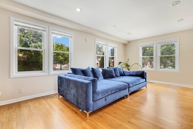 8458 South Constance Avenue Chicago, IL 60617 - Photo 6 of 23 a living room with furniture and windows