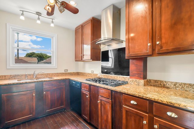 8458 South Constance Avenue Chicago, IL 60617 - Photo 7 of 23 a kitchen with a sink cabinets and window