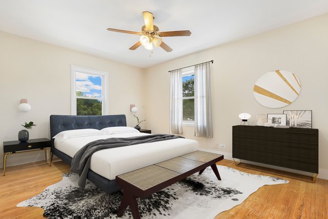 8458 South Constance Avenue Chicago, IL 60617 - Photo 9 of 23 a bedroom with a bed and a dresser