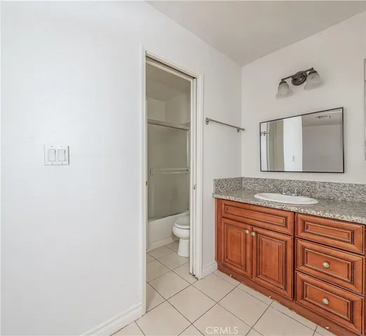 a view of a chair and table in the balcony