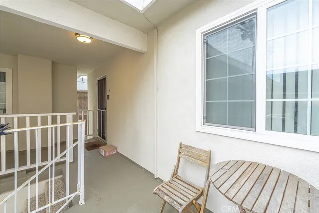 a kitchen with granite countertop a sink stove and cabinets
