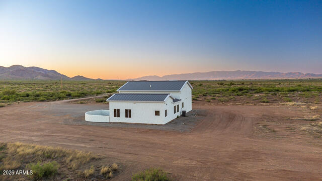 6233 West Airport Road Willcox, AZ 85643 - Photo 52 of 54 a car parked on the side of a road