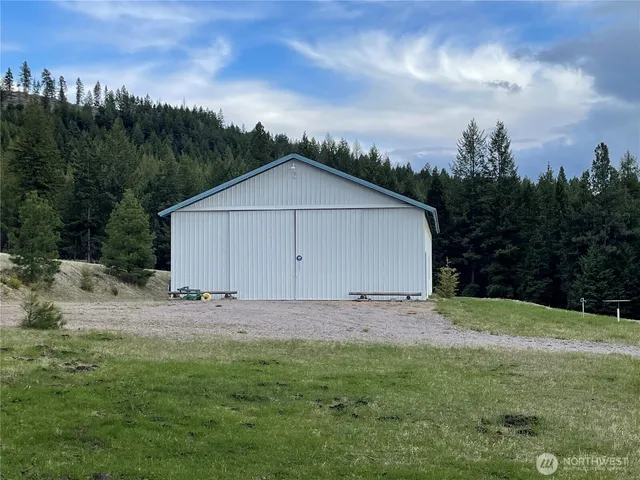 a view of a barn with a yard