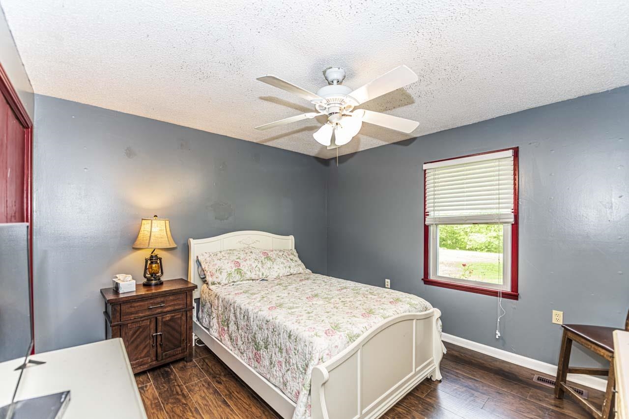 827 Sanford Road Covington, TN 38019 - Photo 12 of 25 a bedroom with a bed and a window
