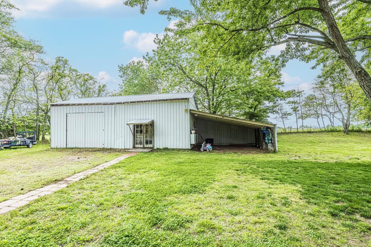 827 Sanford Road Covington, TN 38019 - Photo 24 of 25 a house with a yard
