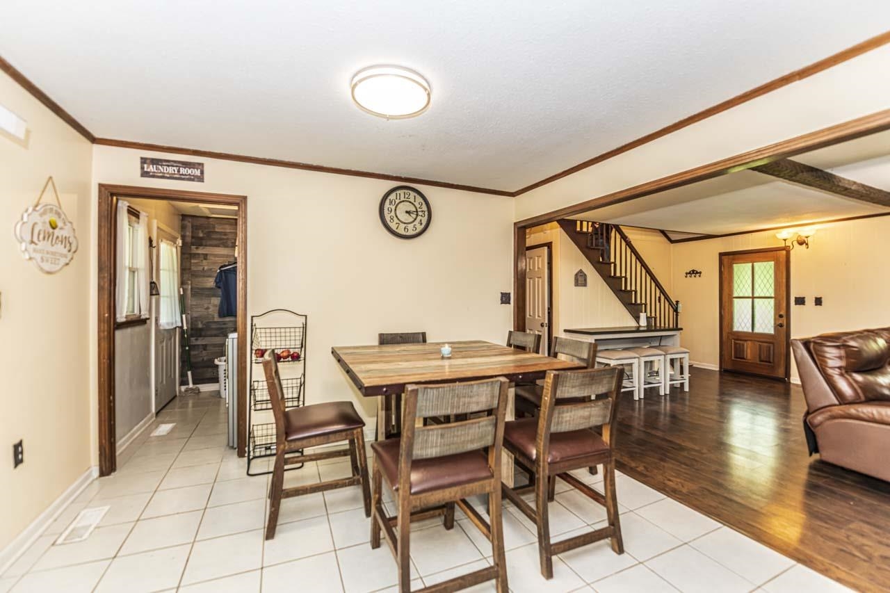 827 Sanford Road Covington, TN 38019 - Photo 6 of 25 a view of a dining room with furniture and wooden floor