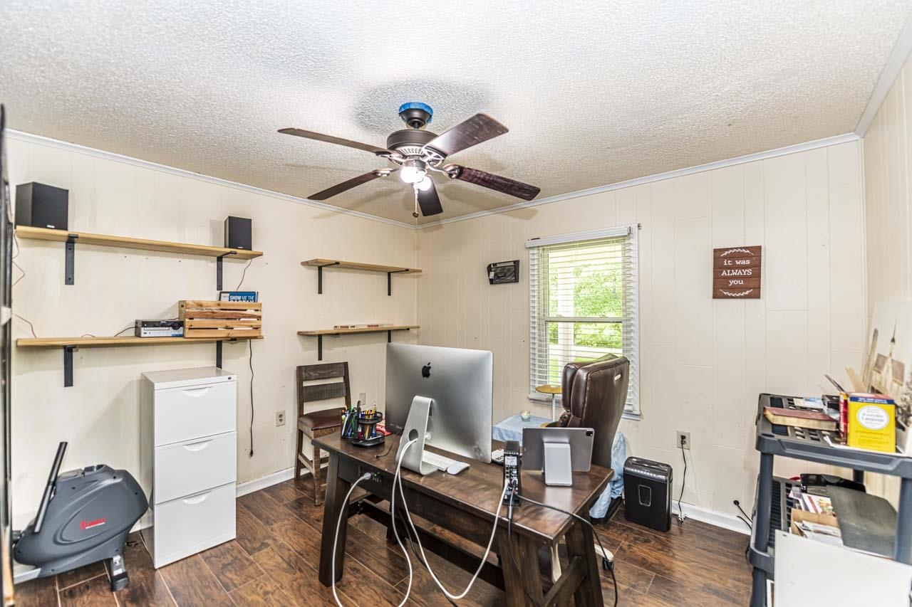 827 Sanford Road Covington, TN 38019 - Photo 10 of 25 a view of a workspace with furniture and a window