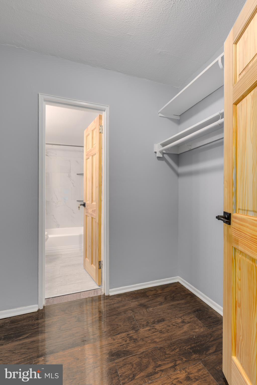 2101-17 Chestnut Street, Unit 705 Philadelphia, PA 19103 - Photo 5 of 10 a view of a small space with wooden floor and a window