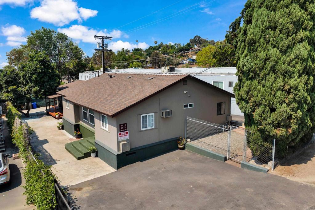 a aerial view of a house with yard and seating area