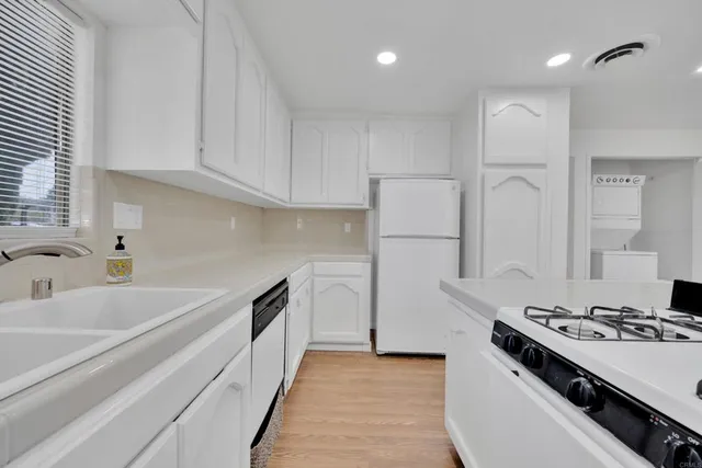 a kitchen with a stove and a refrigerator