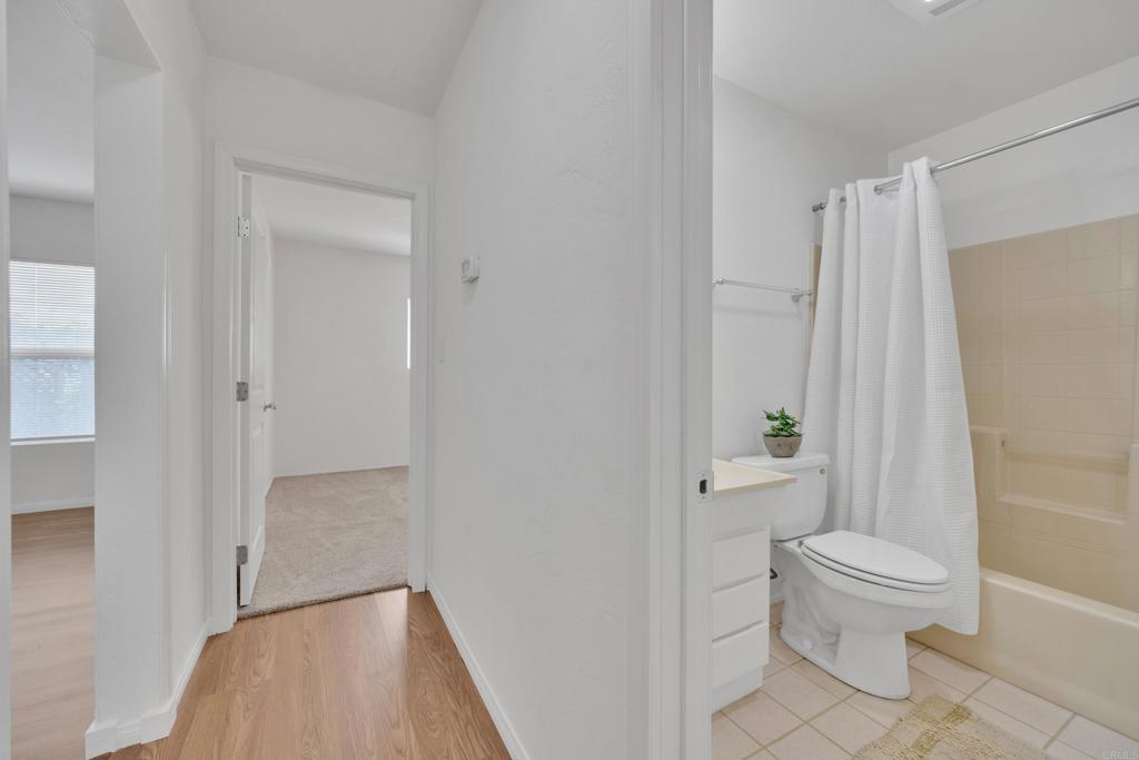 9015-9017 Campo Road Spring Valley, CA 91977 - Photo 22 of 60 a bathroom with a toilet and a shower