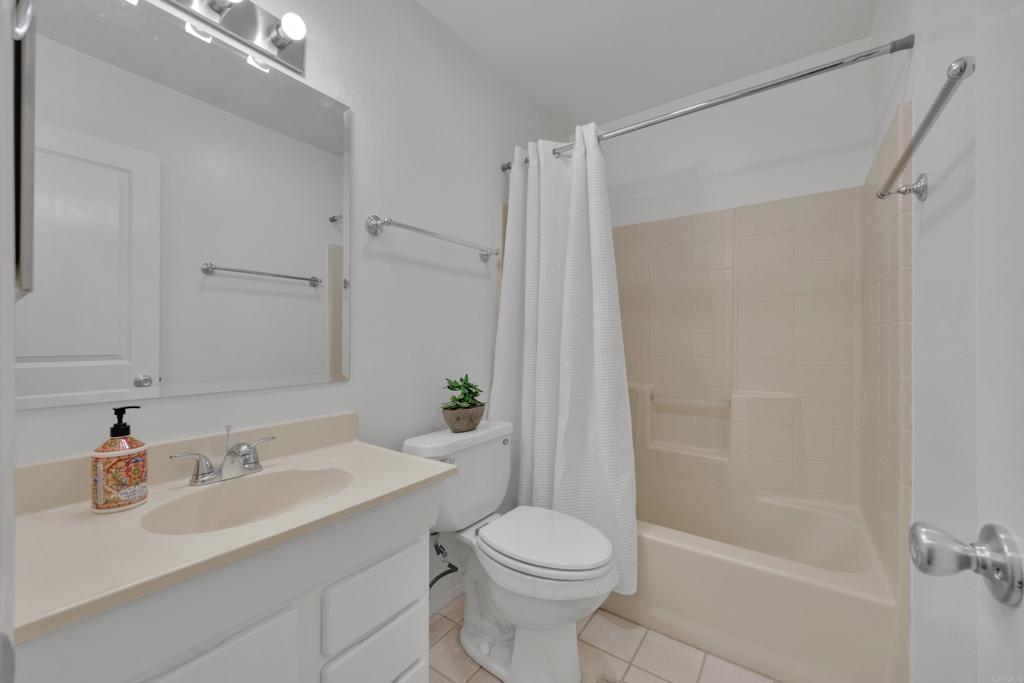 9015-9017 Campo Road Spring Valley, CA 91977 - Photo 23 of 60 a bathroom with a sink toilet and shower