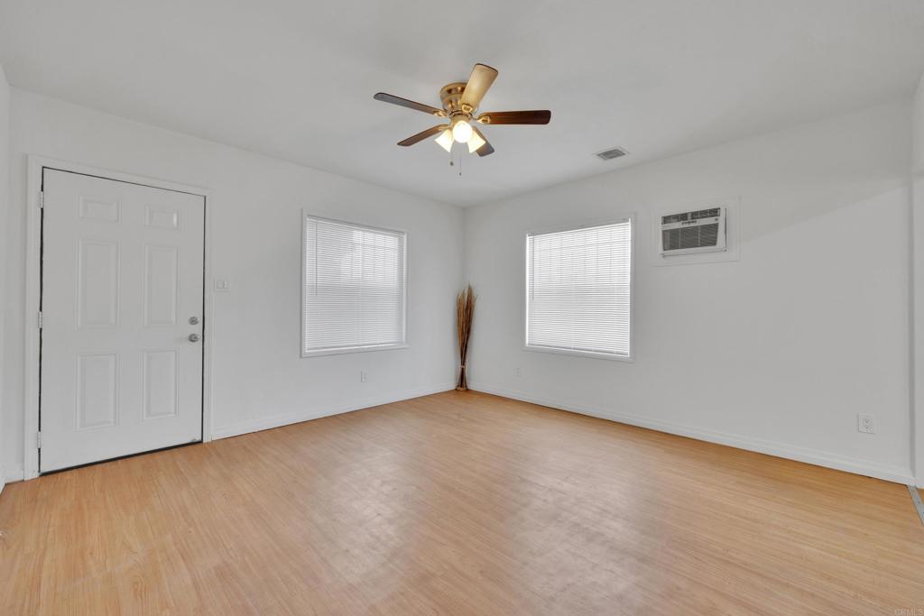 9015-9017 Campo Road Spring Valley, CA 91977 - Photo 31 of 60 a view of an empty room with a window