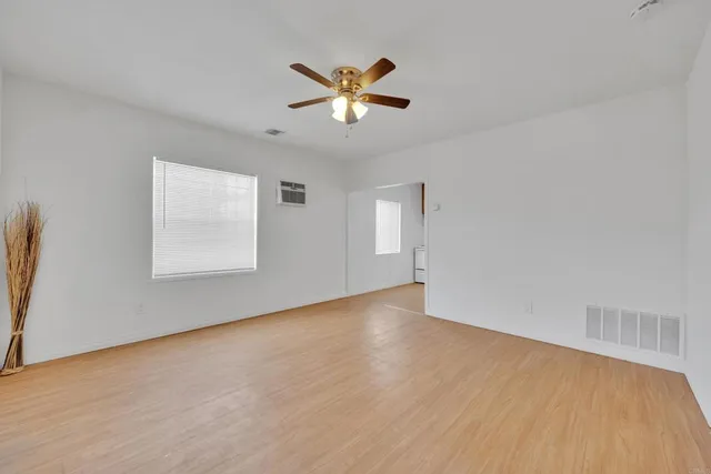 a kitchen with stainless steel appliances granite countertop a sink and a stove